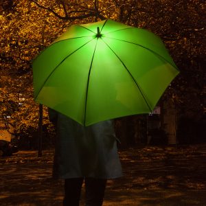 opened green umbrella with LED light