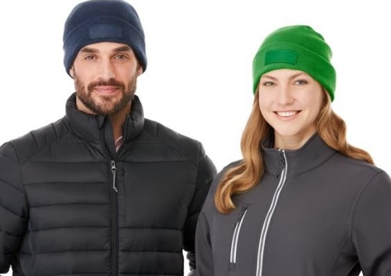 Man and woman wearing beanies and jackets